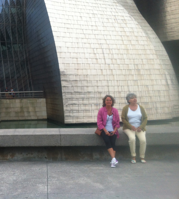 Elizabeth (right) in her arty Cydwoq Link shoes sits outside the Guggeheim in Bilbao, Spain.