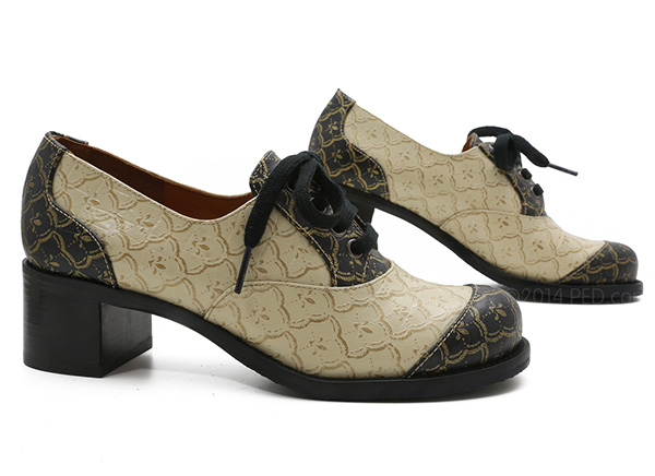 Chie Mihara Frias in black and cream leather embossed with gold